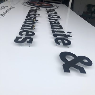 cut-out i-bond letter standing proud of backing